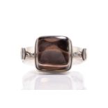 Georg Jensen - a tension clamp opening smoky quartz bangle, with a square smoky quartz block in