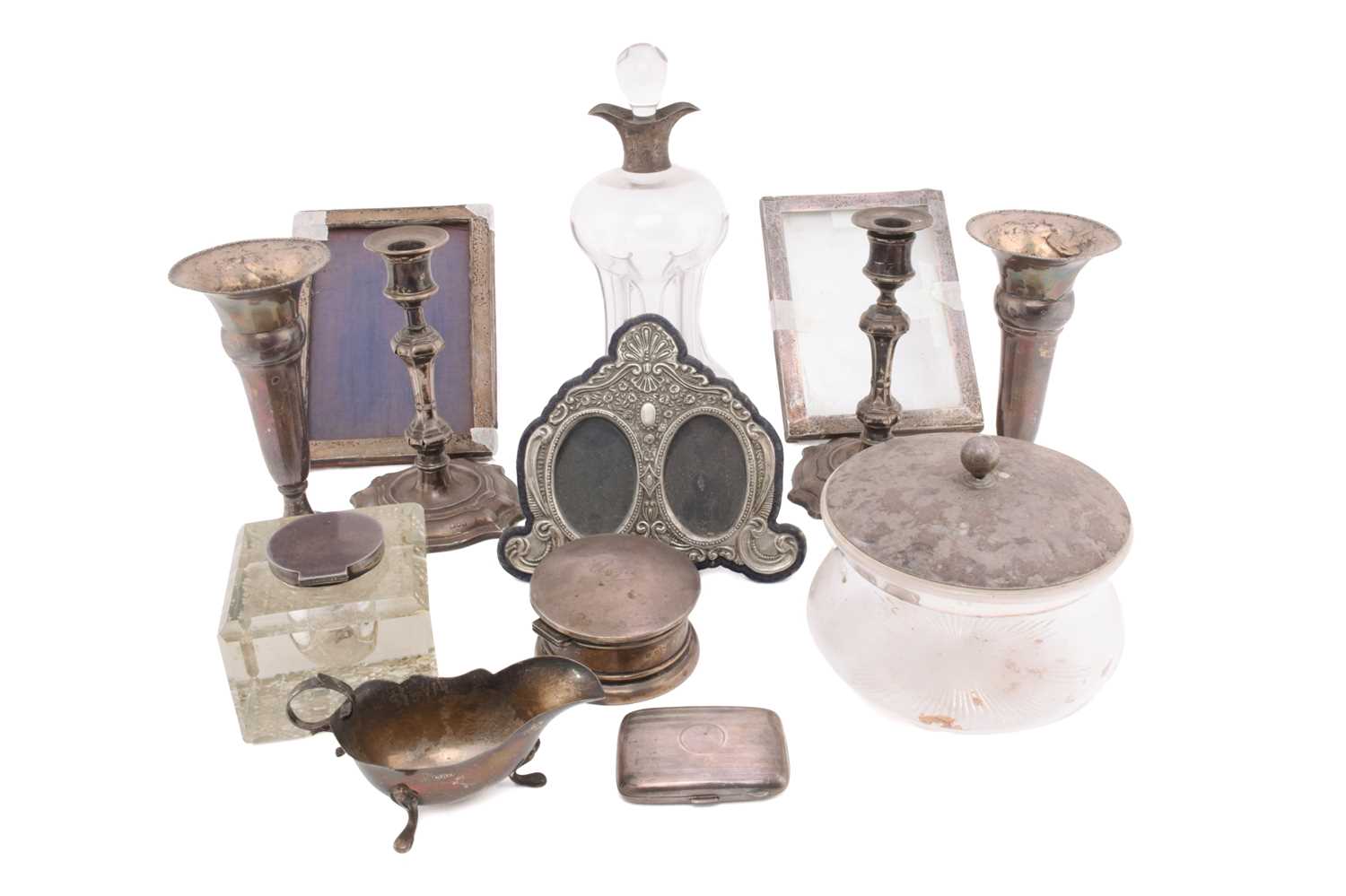 A small collection of silver, comprising a pair of candlesticks with weighted bases, 18.5cm, a - Image 21 of 34