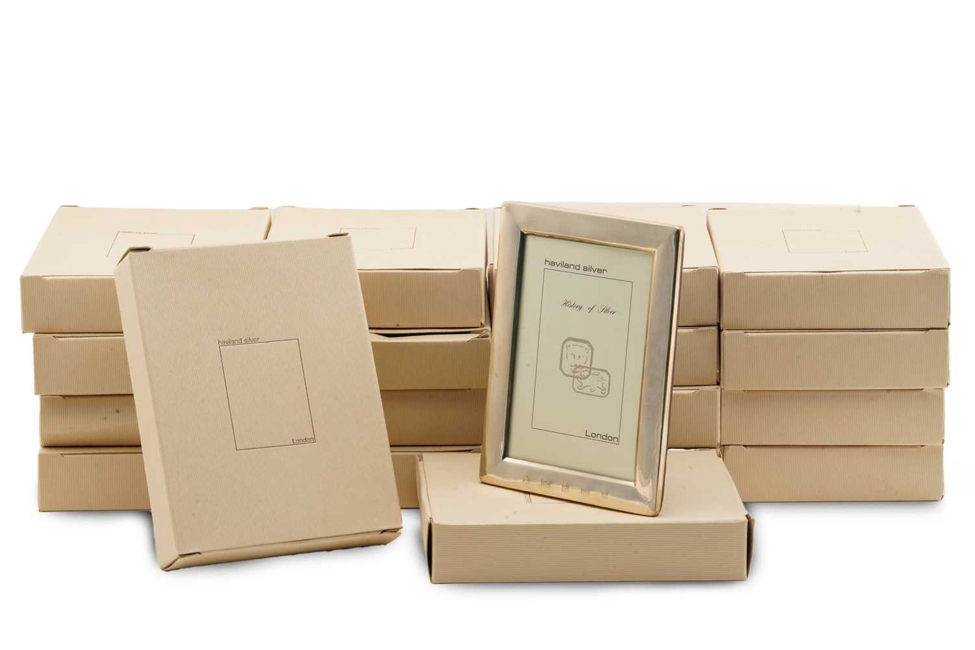 A group of eighteen boxed 4in x 6in silver photo frames; London hallmarked with A Haviland-Nye