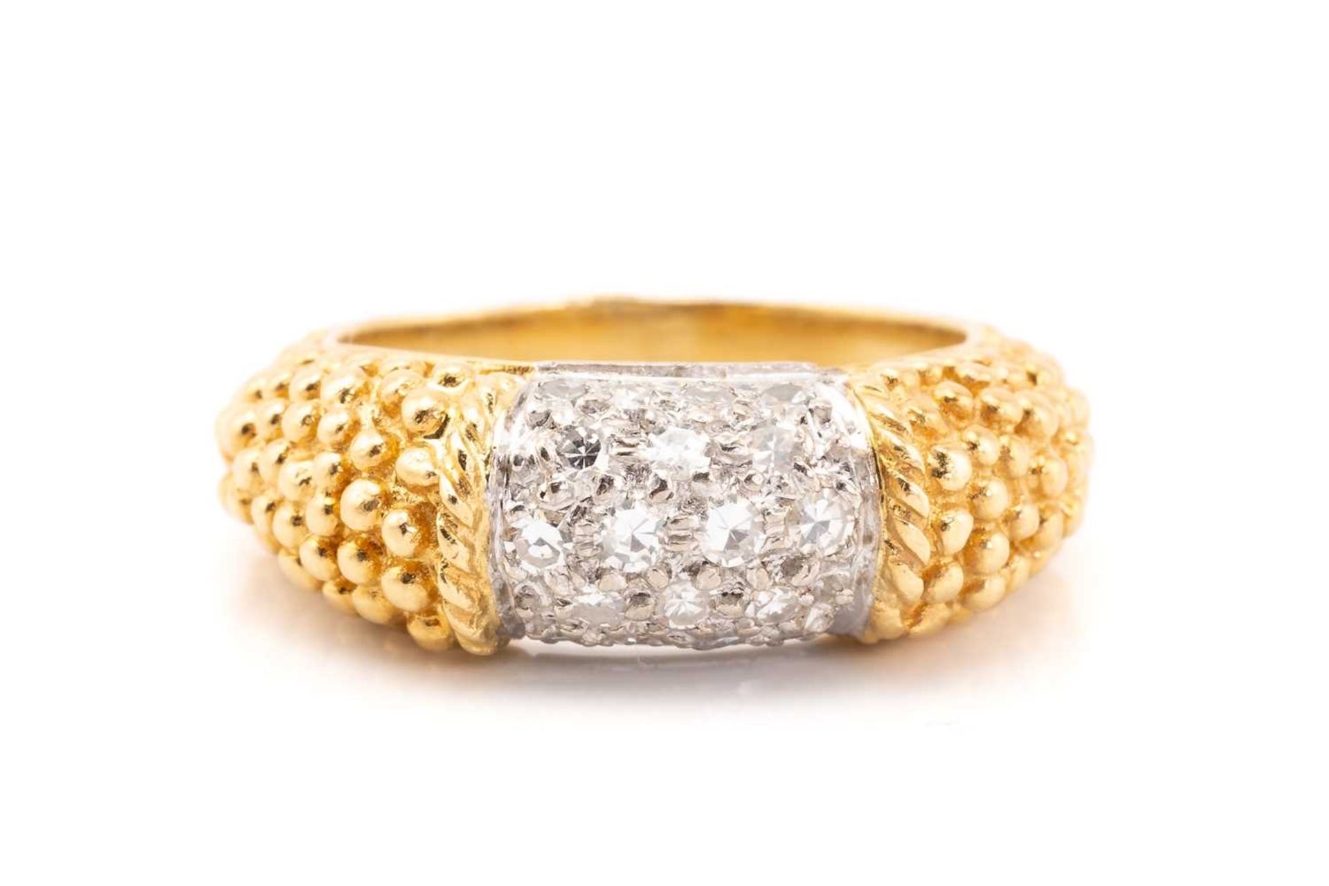 An 18 carat gold and diamond ring saddle ring; the curved centre panel pavé set with brilliant cut