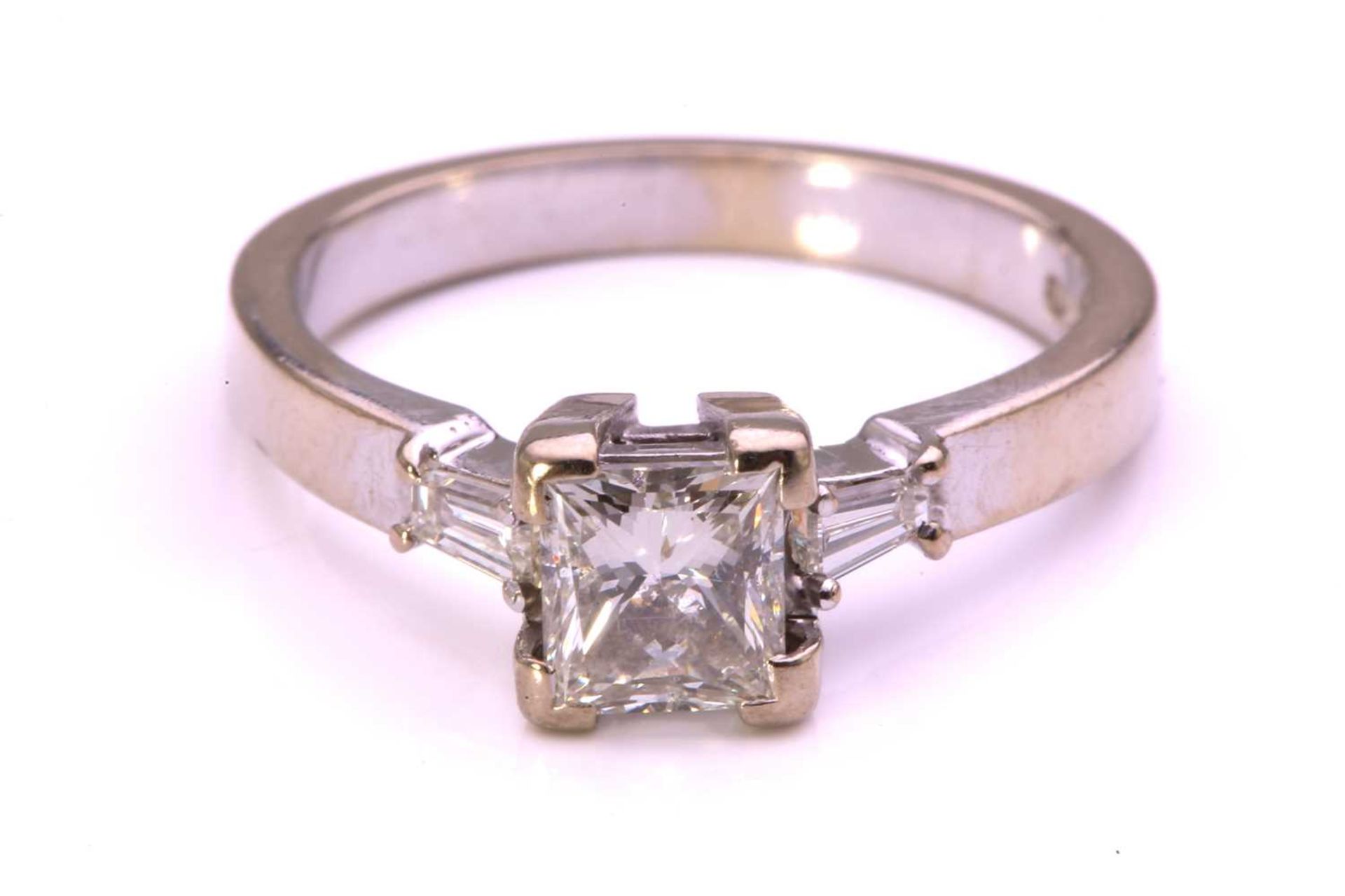 A princess-cut diamond solitaire ring in 9ct white gold, comprising a rectangular princess-cut