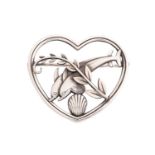 Georg Jensen - a 'double dolphin' brooch, depicting two dolphins leaping over a sea shell with a