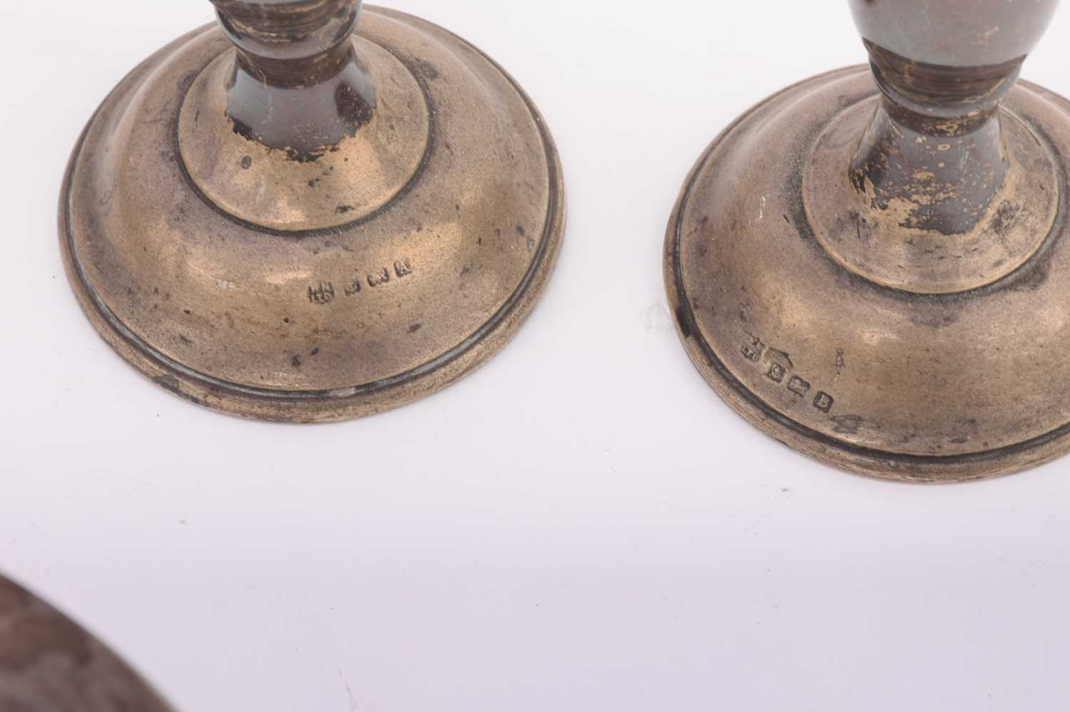 A small collection of silver, comprising a pair of candlesticks with weighted bases, 18.5cm, a - Image 26 of 34