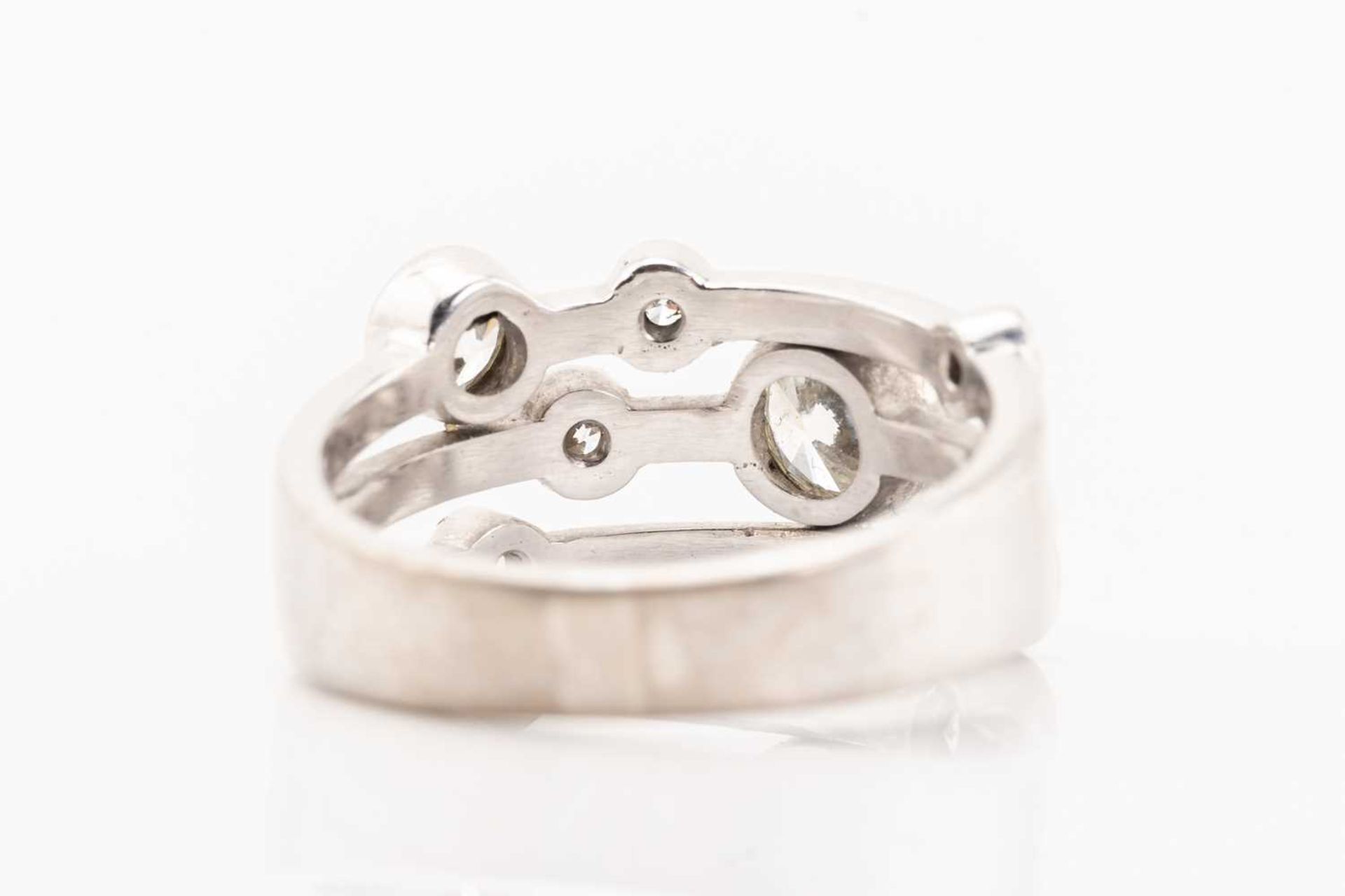 An 18ct gold diamond ring in Raindance-styled design, constructed of three conjoining bands and - Image 3 of 7