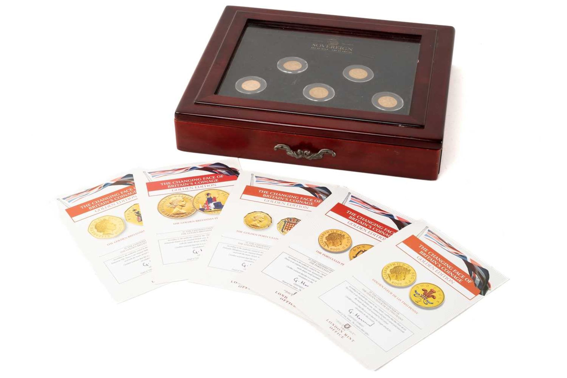 A collection of seven gold sovereigns and a collection of gilt nickel coins, comprising; a Victorian