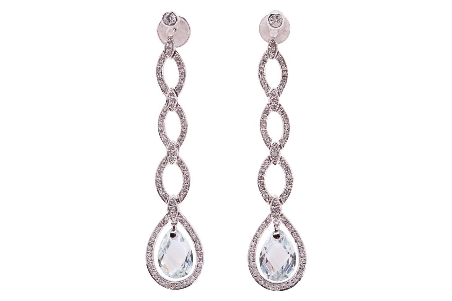 A pair of diamond and aquamarine dangle earrings, each containing a chequerboard-cut aquamarine drop