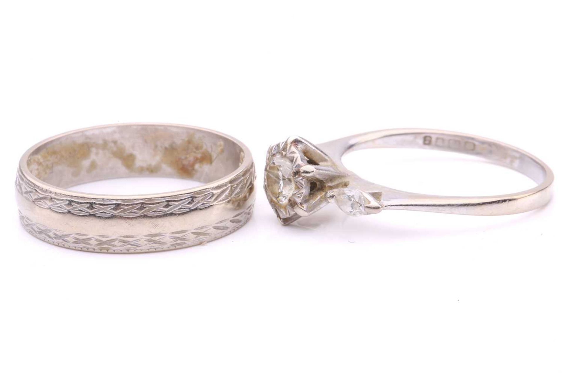 A three-stone diamond ring and a wedding band en-suite in 18ct white gold; the first ring - Image 4 of 4