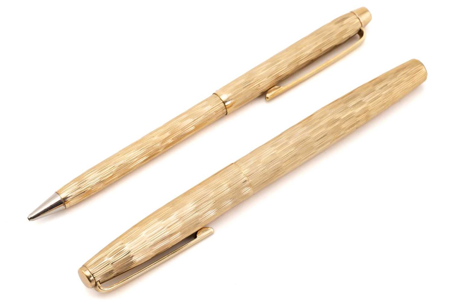 Asprey. A cased 9 carat gold ball point pen and pencil, bark finish engine-turned bodies. The pen - Image 2 of 5