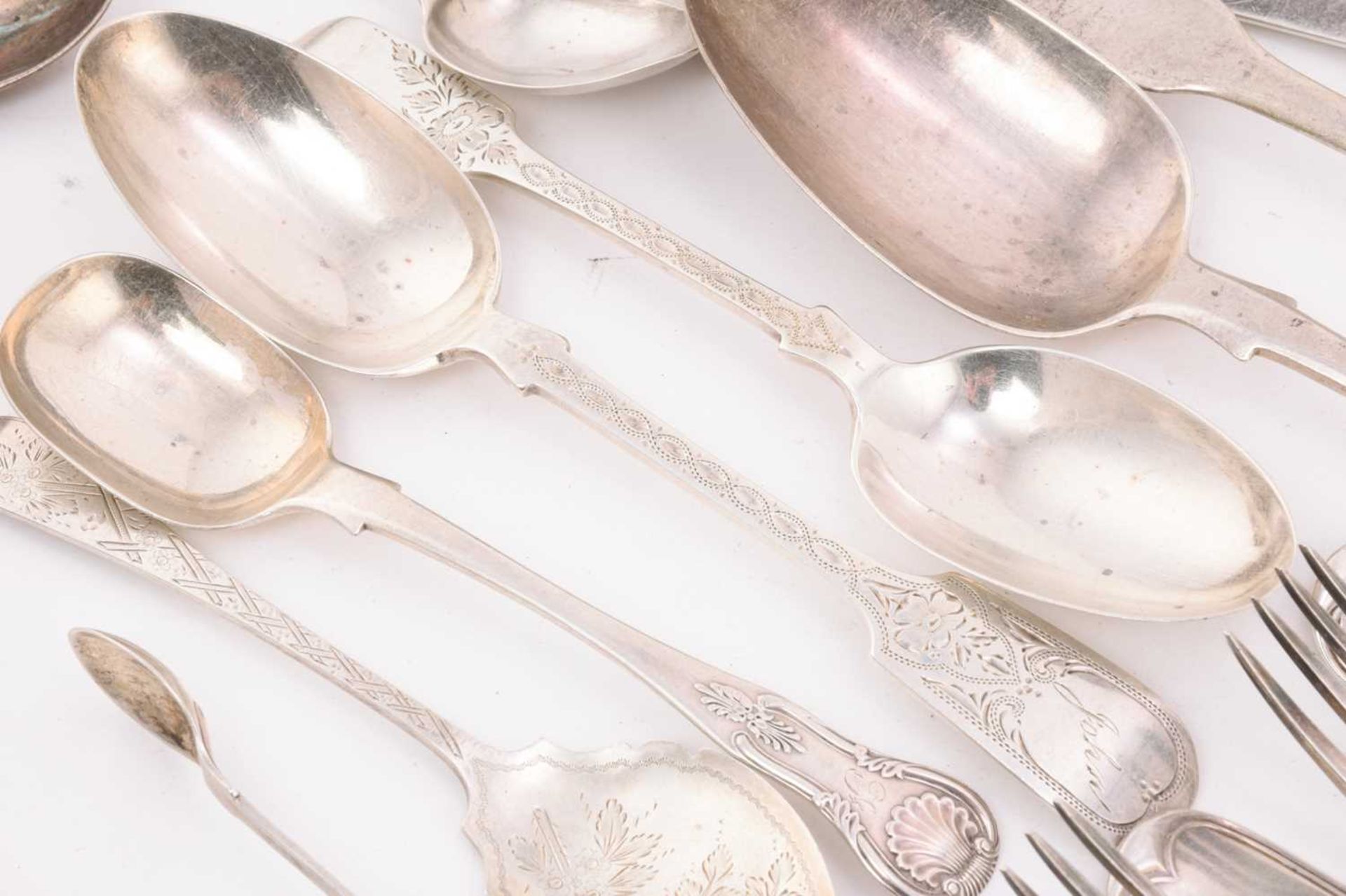 A collection of mixed assayed silver flatware, comprising a large basting spoon, two serving spoons, - Image 2 of 7