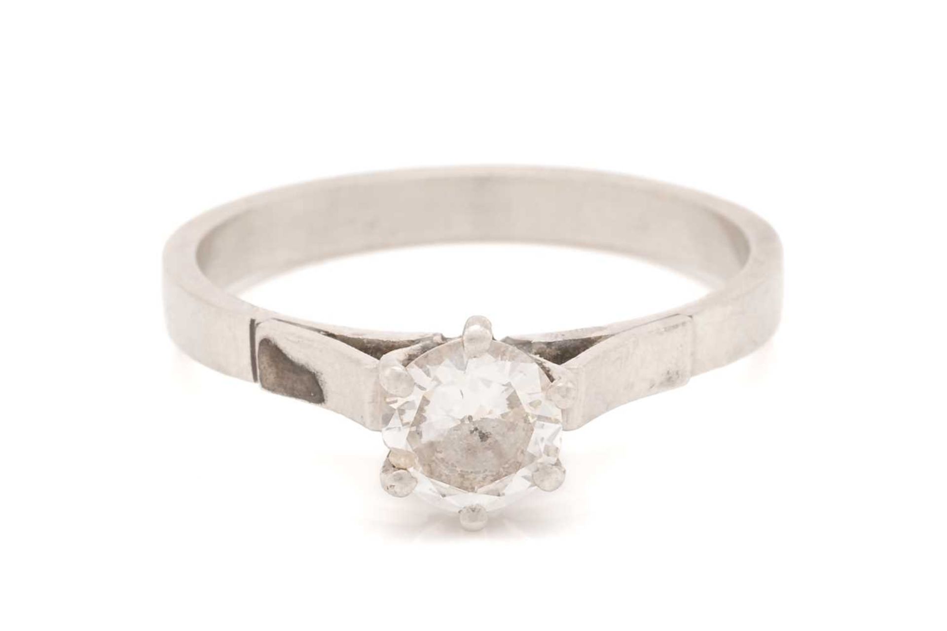 A diamond solitaire ring in platinum, comprising a brilliant-cut diamond in a high-profile six-claws - Image 2 of 6