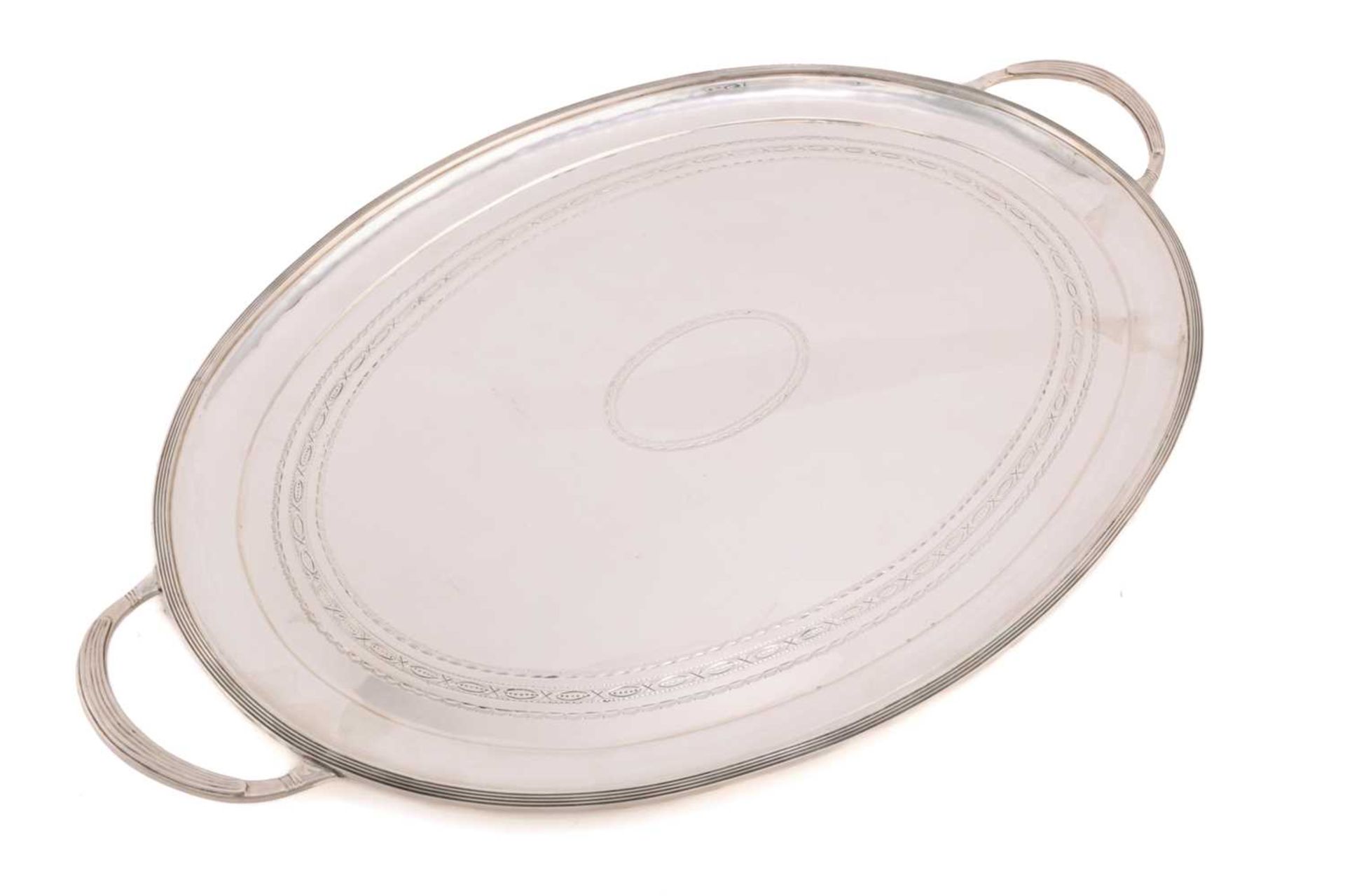 A 20th century silver tray, London 1977 by A Haviland-Nye, of oval form with bright-cut decoration