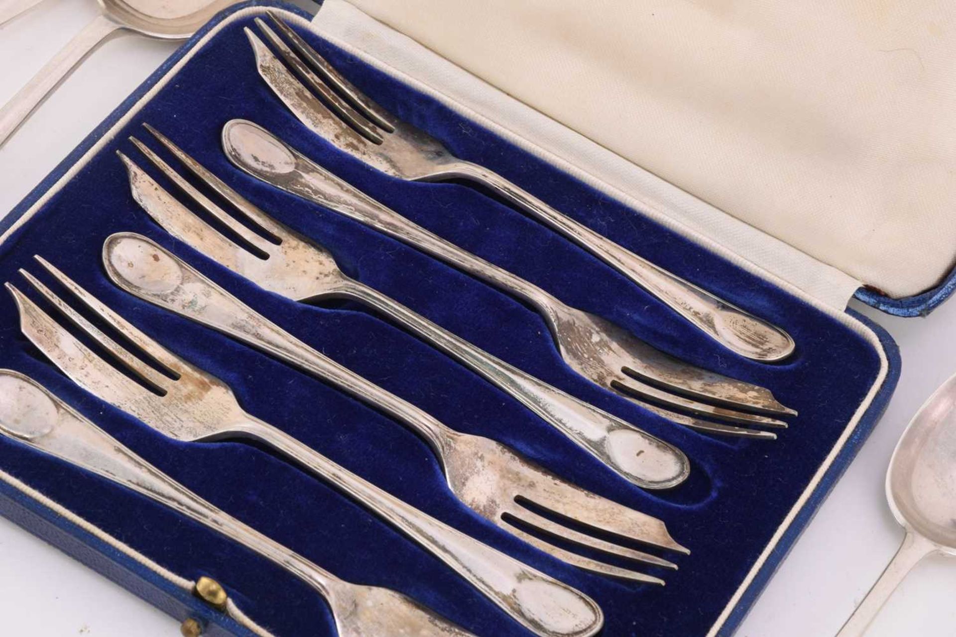 A collection of mixed assayed silver flatware, comprising a large basting spoon, two serving spoons, - Image 6 of 7