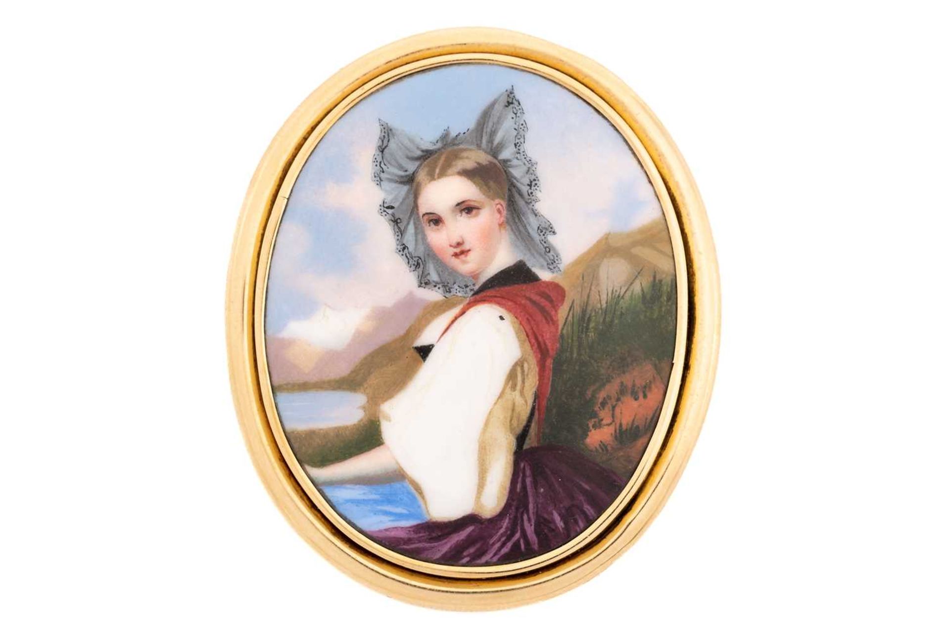 A Victorian brooch the oval enamel plaque painted with a portrait of a lady in a mountainous