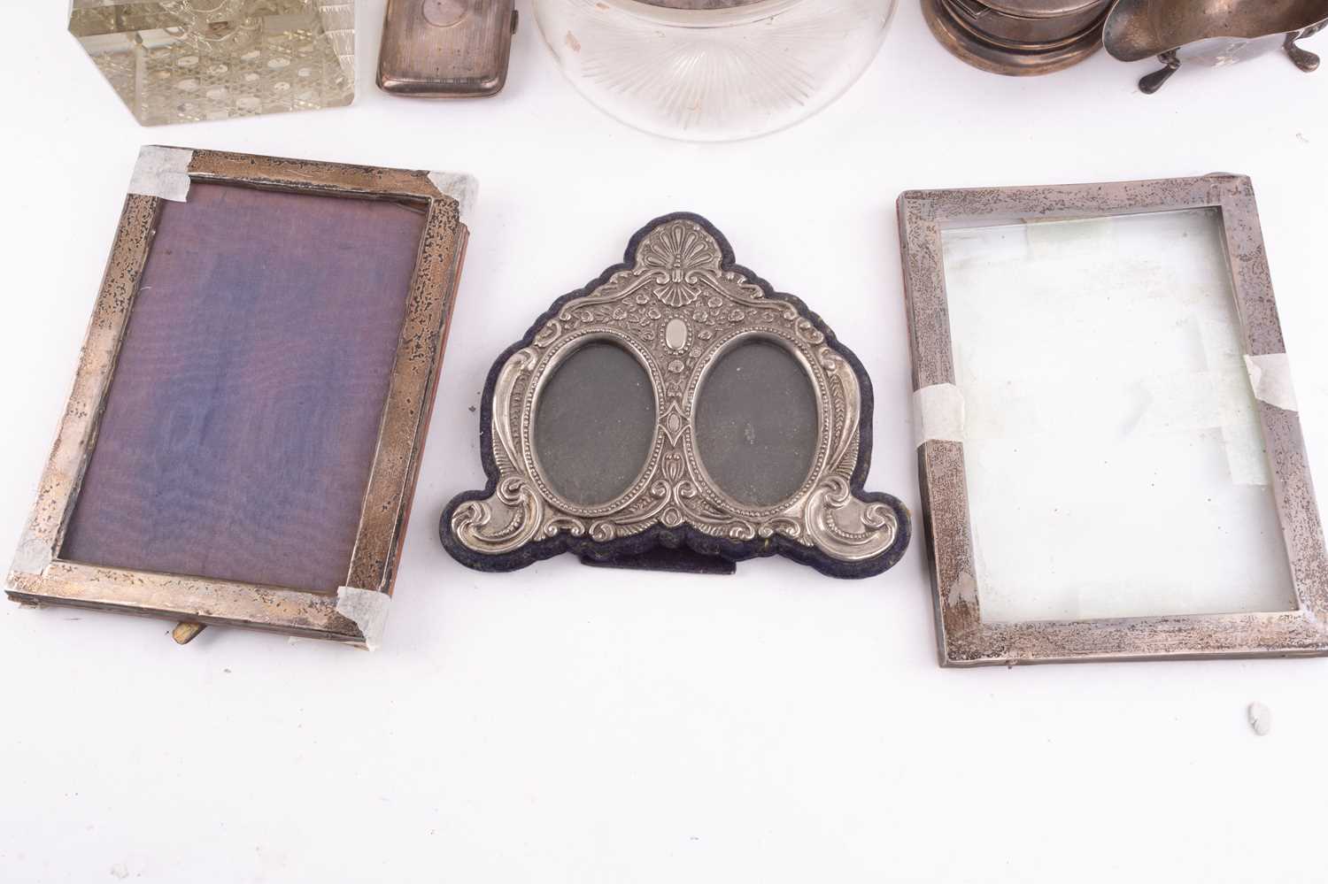 A small collection of silver, comprising a pair of candlesticks with weighted bases, 18.5cm, a - Image 18 of 34