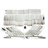 A mixed collection of various modern silver-handled cutlery including pistol handle knives,