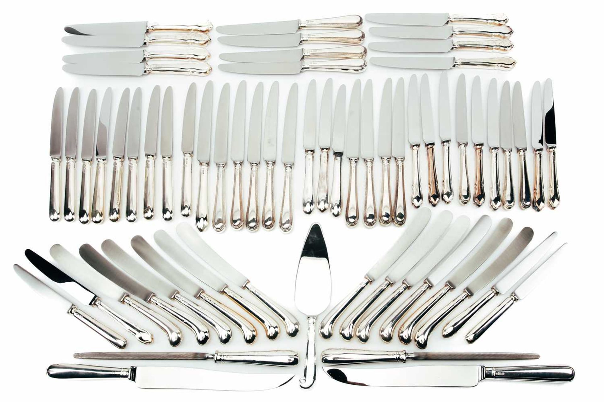 A mixed collection of various modern silver-handled cutlery including pistol handle knives,