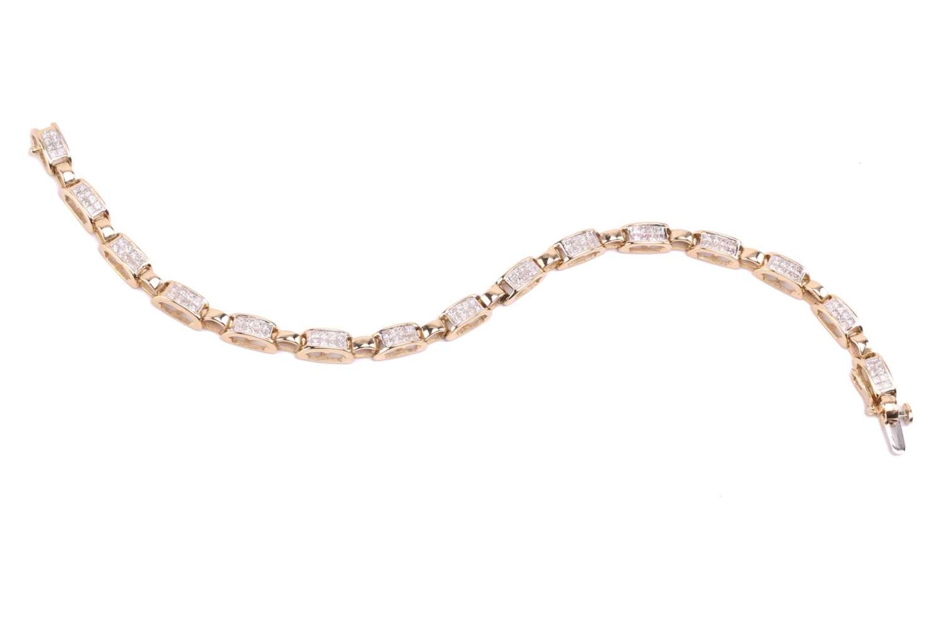 A princess cut diamond line bracelet, with 15 oval cut-out sections channel set with princess cut