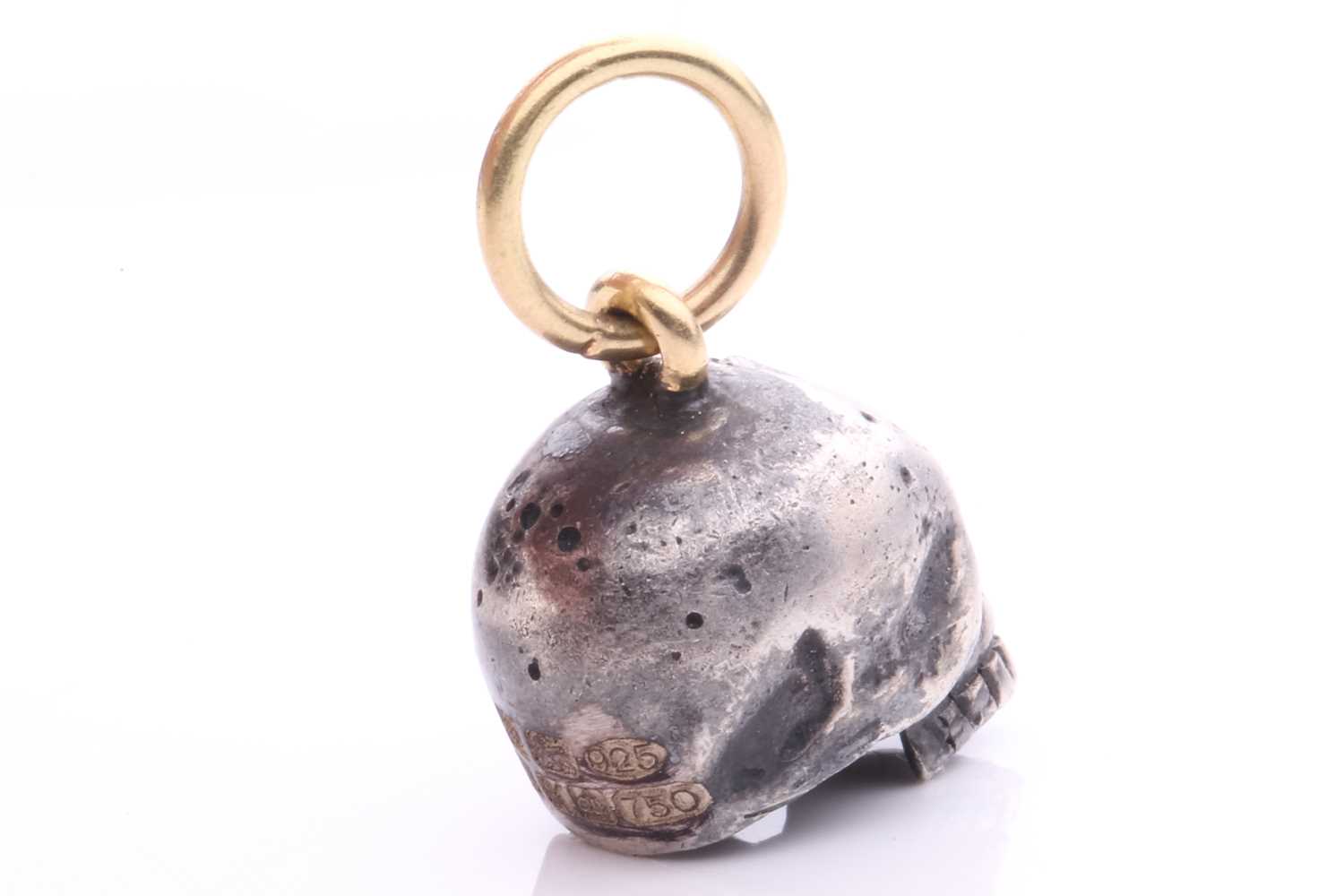 A diamond-set skull charm pendant in silver and 18ct gold, a sculpted hollow skull with eyes set - Image 4 of 6