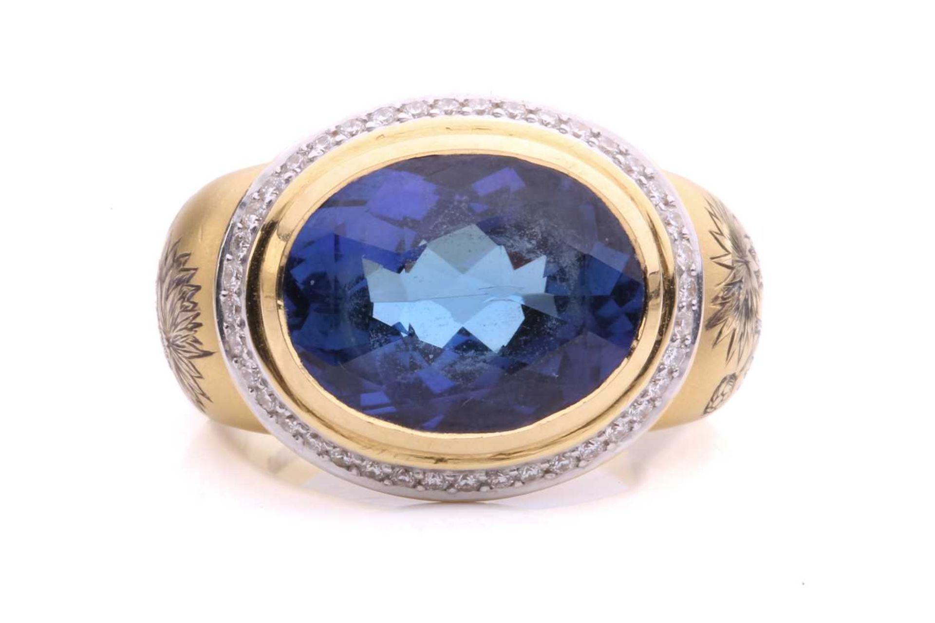 Theo Fennell - A tanzanite and diamond dress ring in 18ct gold, featuring oval-shaped rose-cut