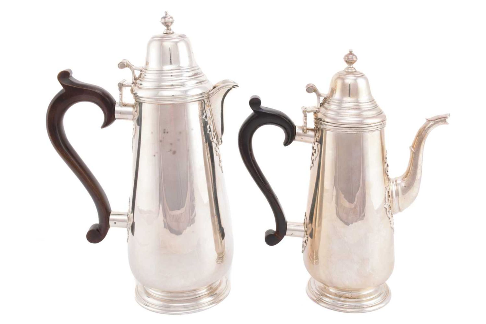 A silver hot water jug and coffee pot, London 1970 by A Haviland-Nye, both with a domed lid above