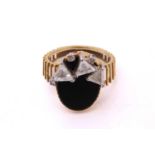 An 18ct gold Modernist ring set with onyx and diamonds, featuring three triangular step-cut diamonds