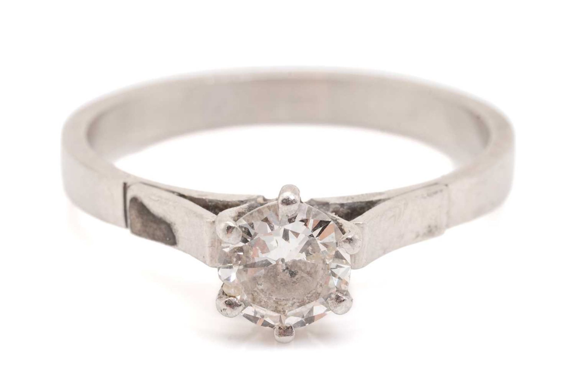 A diamond solitaire ring in platinum, comprising a brilliant-cut diamond in a high-profile six-claws