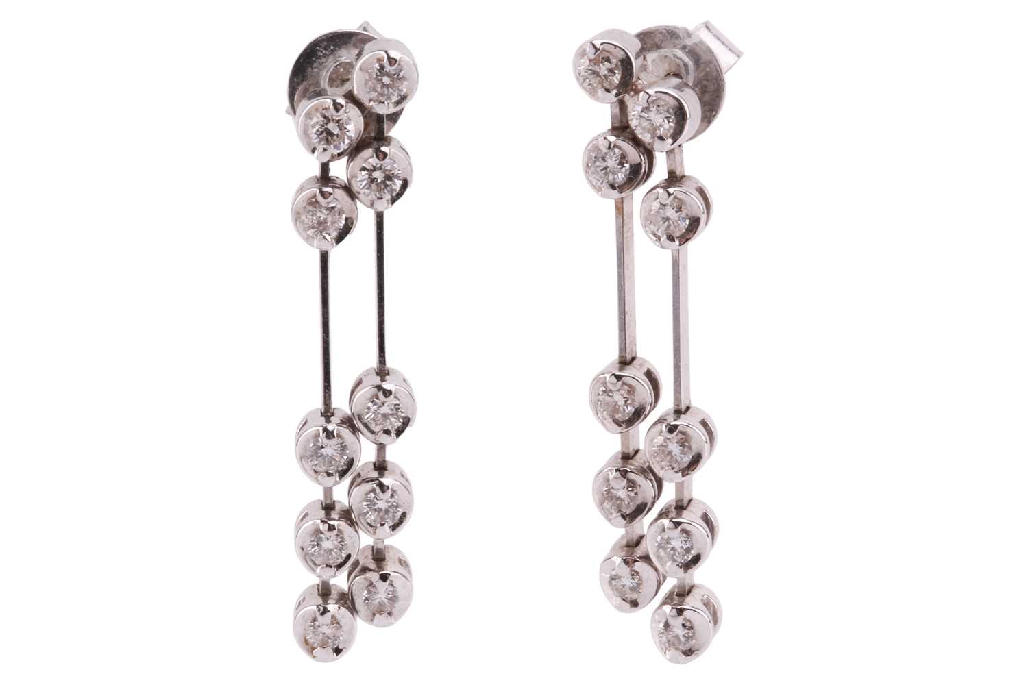 A pair of diamond drop earrings in 18ct white gold, each containing two lines of articulated