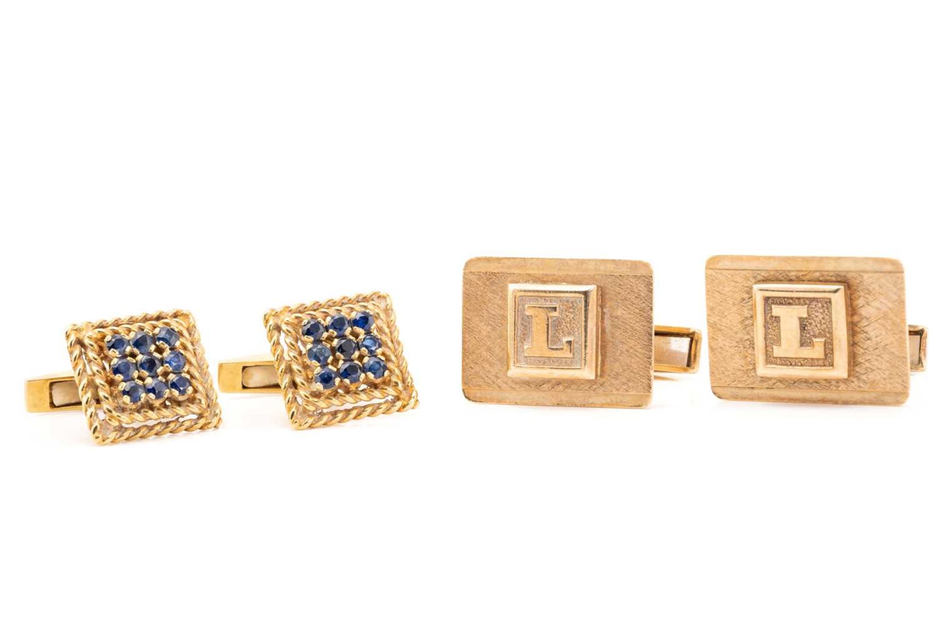 A pair of 18 carat gold and sapphire cufflinks; composed of square panels centrally set with nine