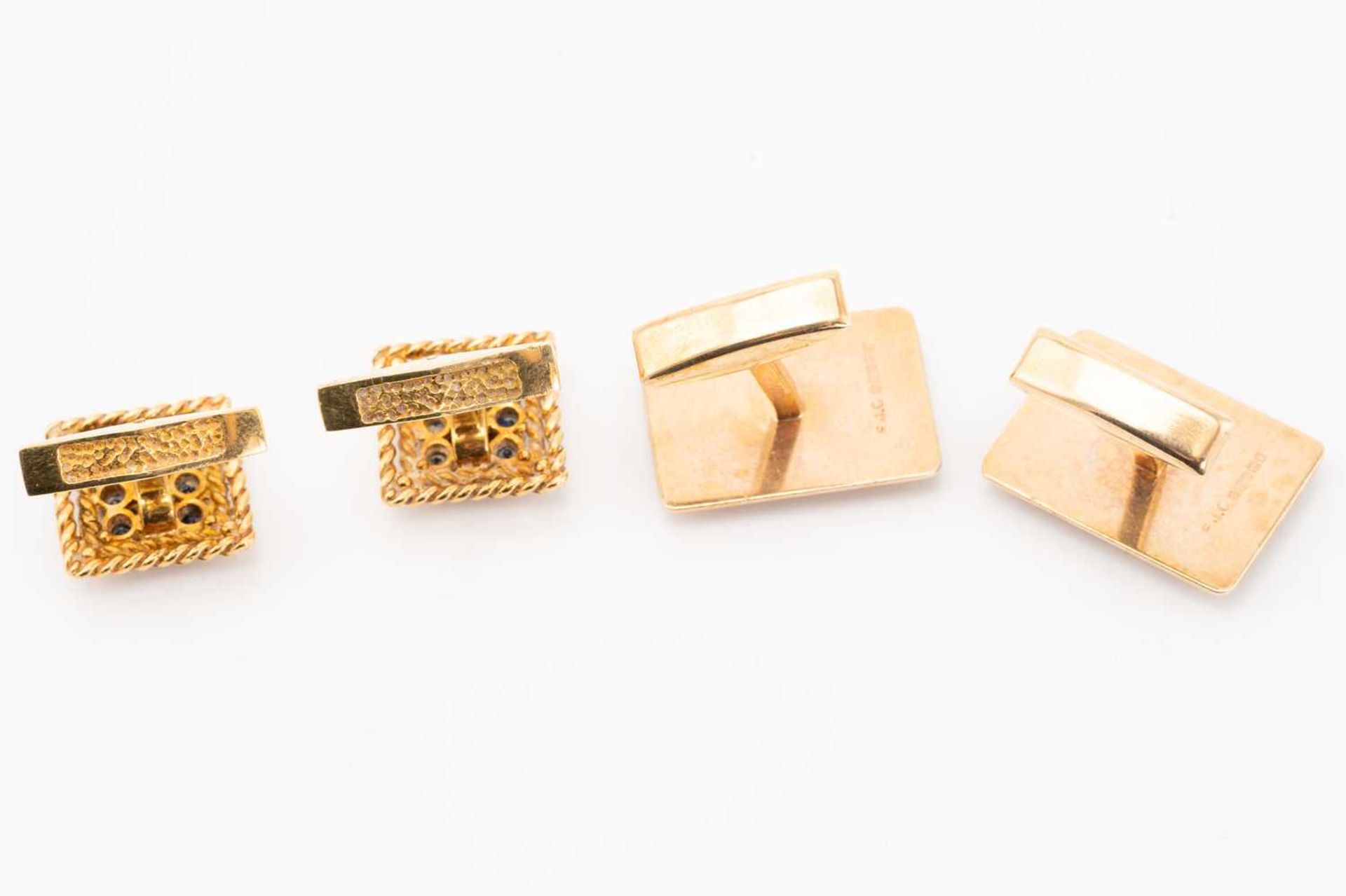 A pair of 18 carat gold and sapphire cufflinks; composed of square panels centrally set with nine - Image 2 of 5