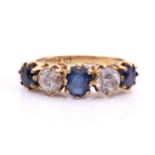 A five-stone diamond and sapphire half-hoop ring, with graduated faceted sapphires in coronet