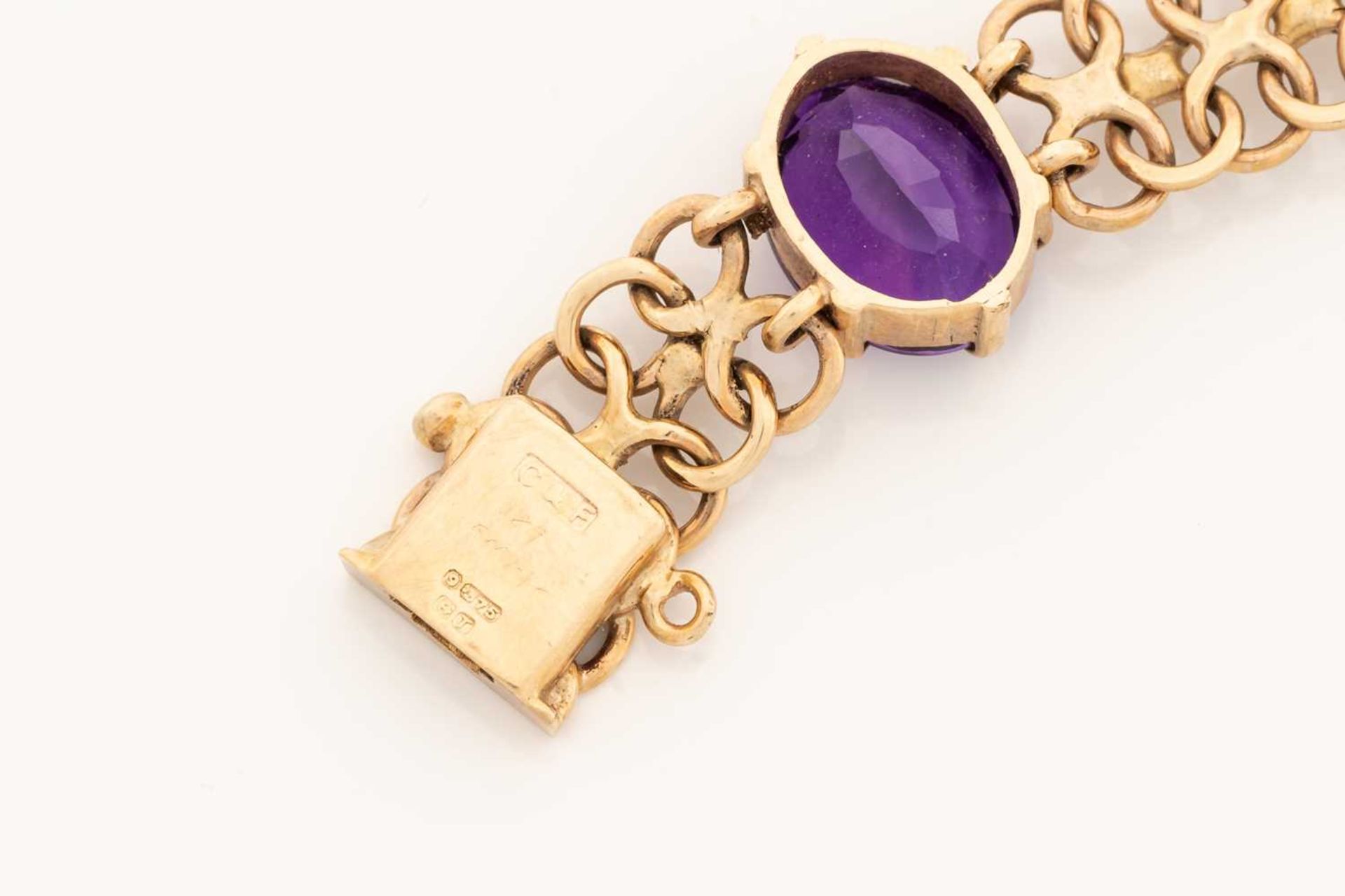 A bracelet set with amethysts in 9ct gold, comprising a wide bismarck link with six oval-cut - Image 4 of 5