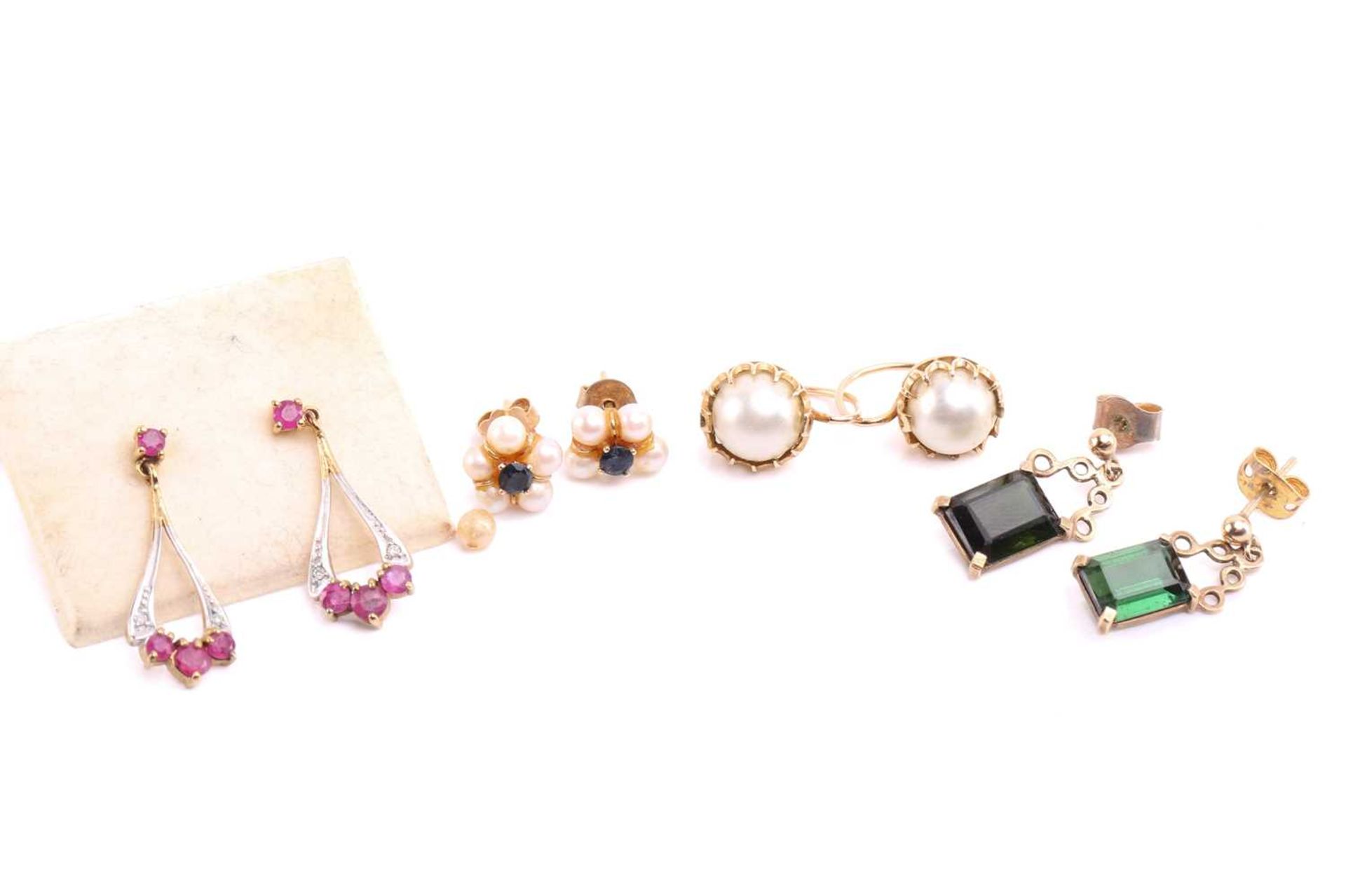 Four pairs of gem-set earrings; including a pair of 9ct gold drop earrings set with pink stones; a