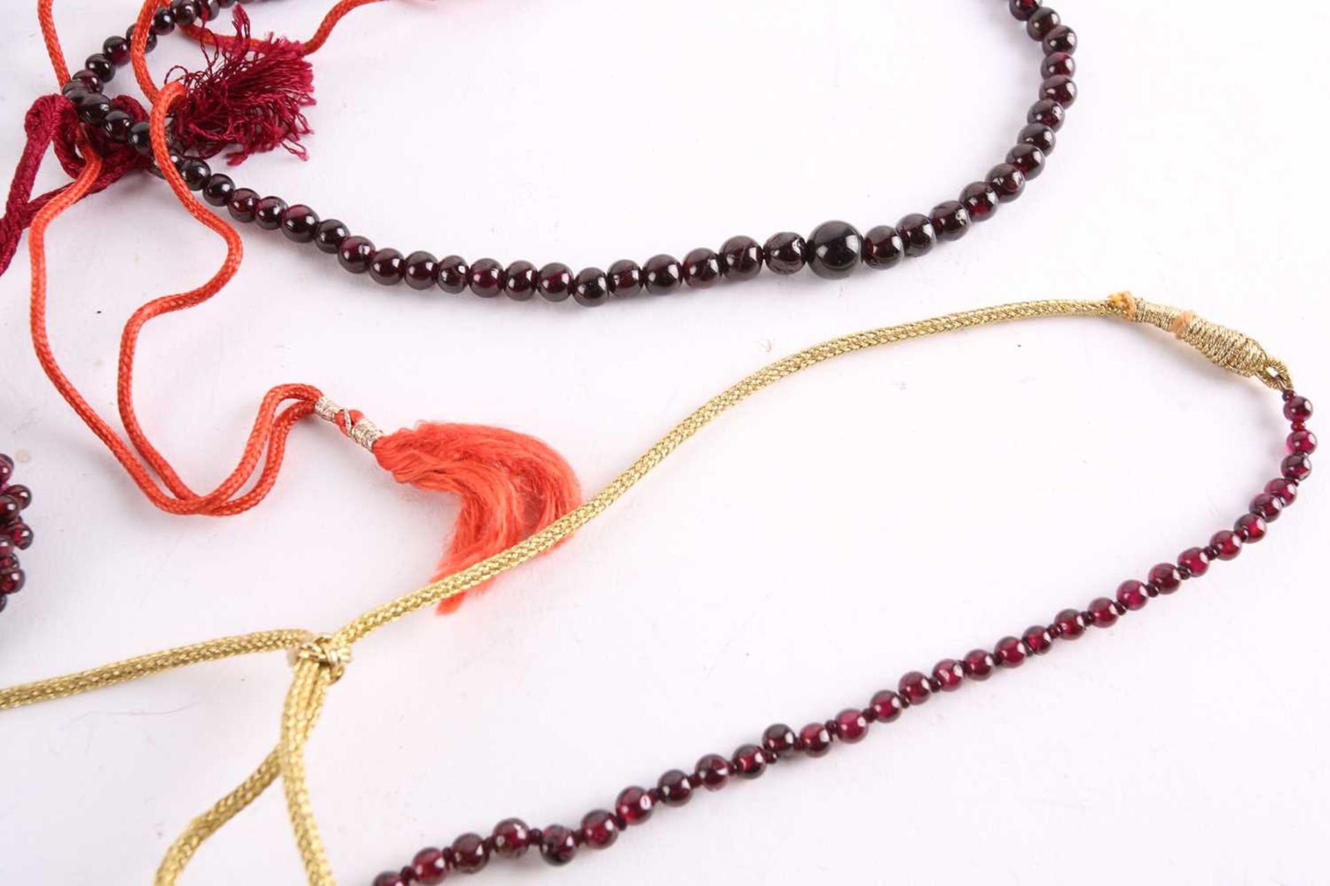 A large collection of garnet beaded jewellery; including four drawstring necklaces with adjustable - Image 8 of 8