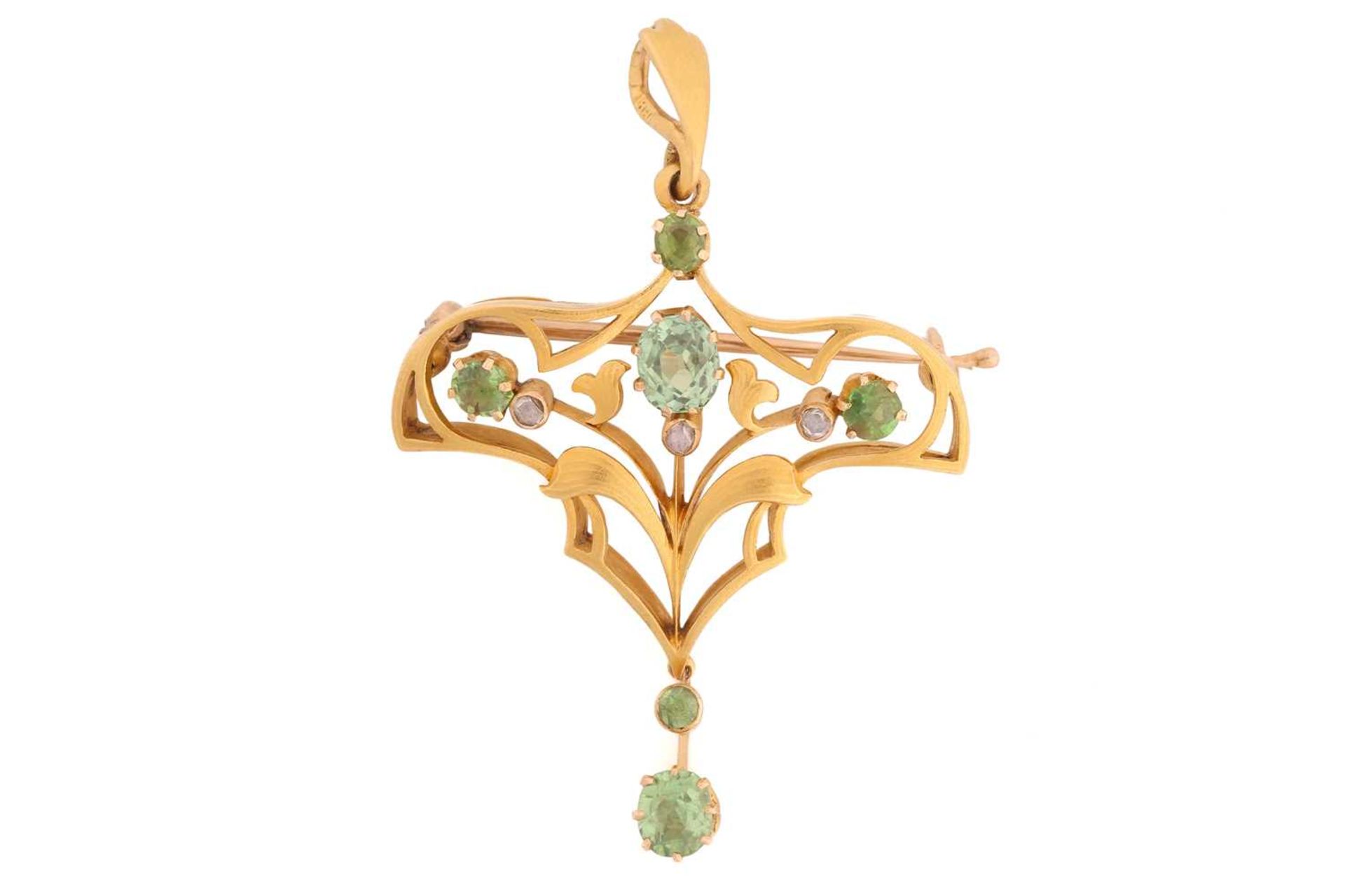An early 20th-century Russian pendant brooch set with diamonds and demantoid garnets, of floral