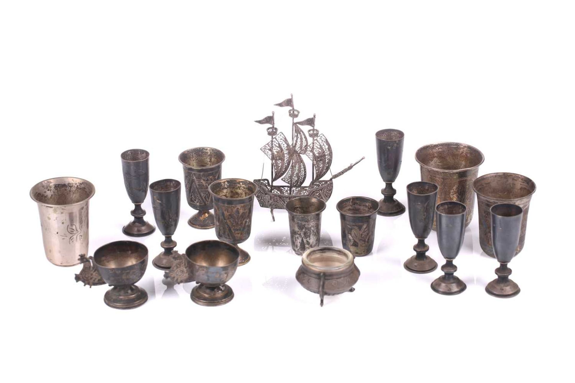Three pairs of Russian silver vodka cups, each engraved with buildings and foliage, a set of six