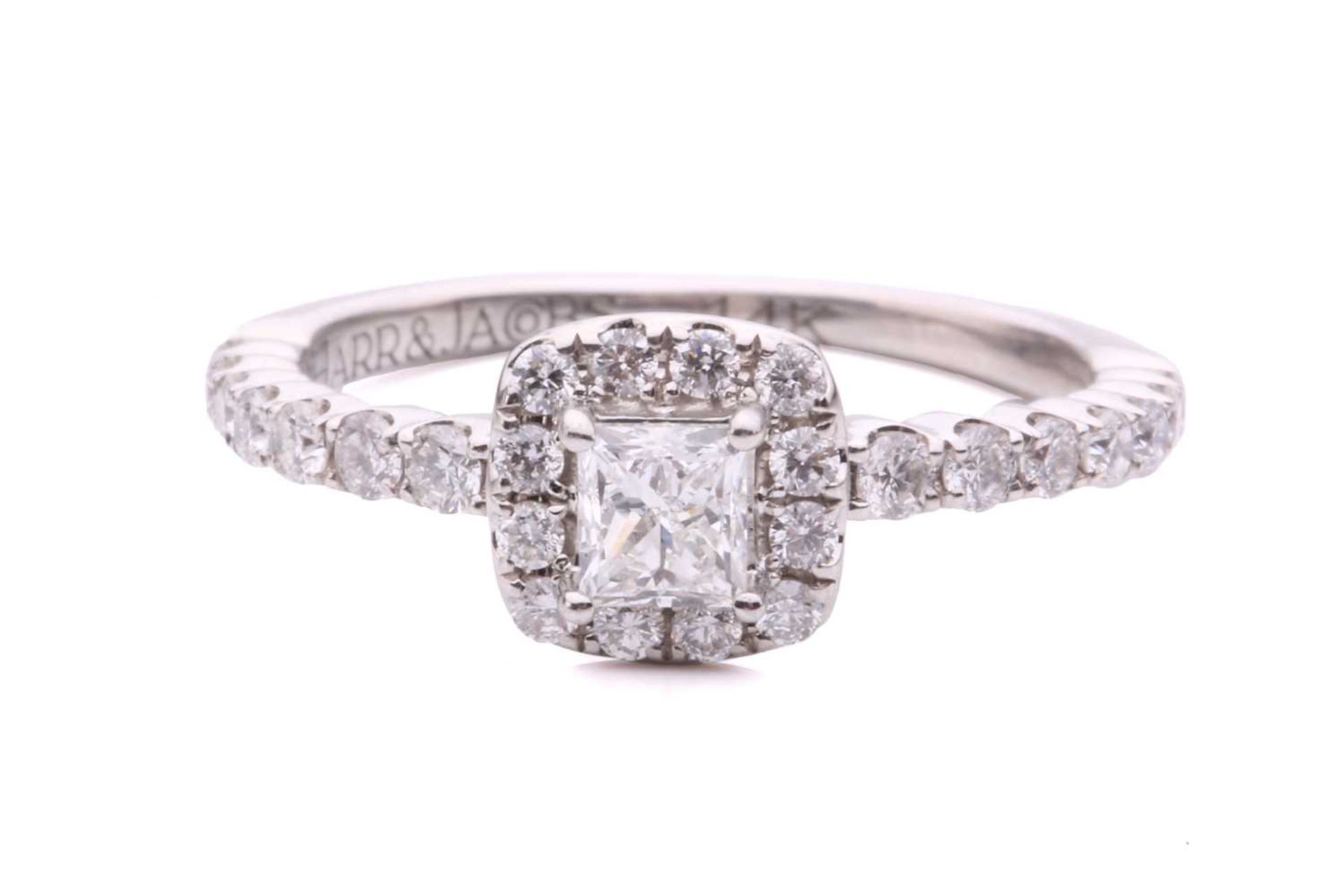 A princess-cut diamond halo ring, with a central claw set princess-cut diamond measuring 3.6x3.3mm