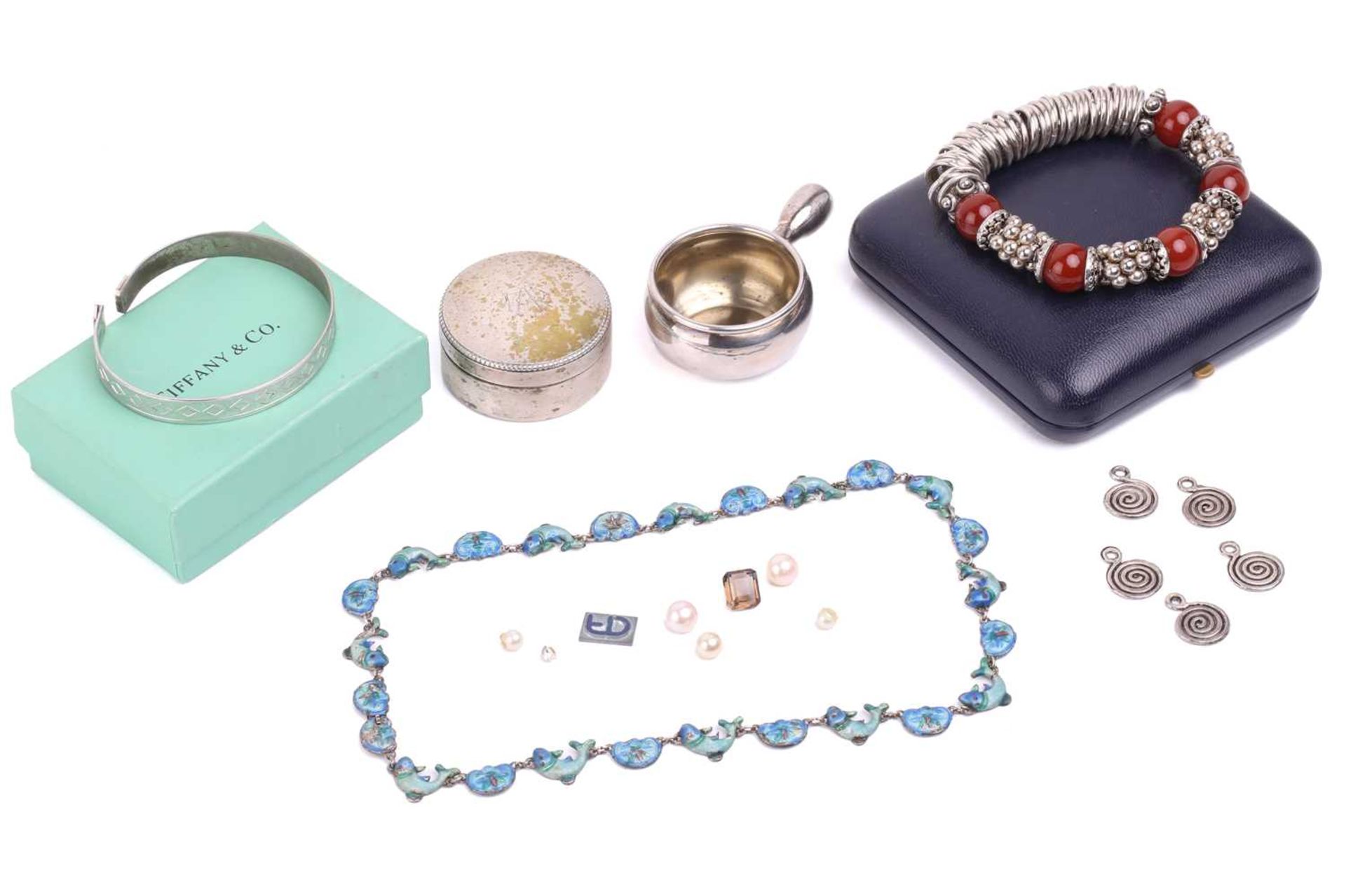 A small collection of jewellery items, including a silver and enamel fish necklace, a modern white