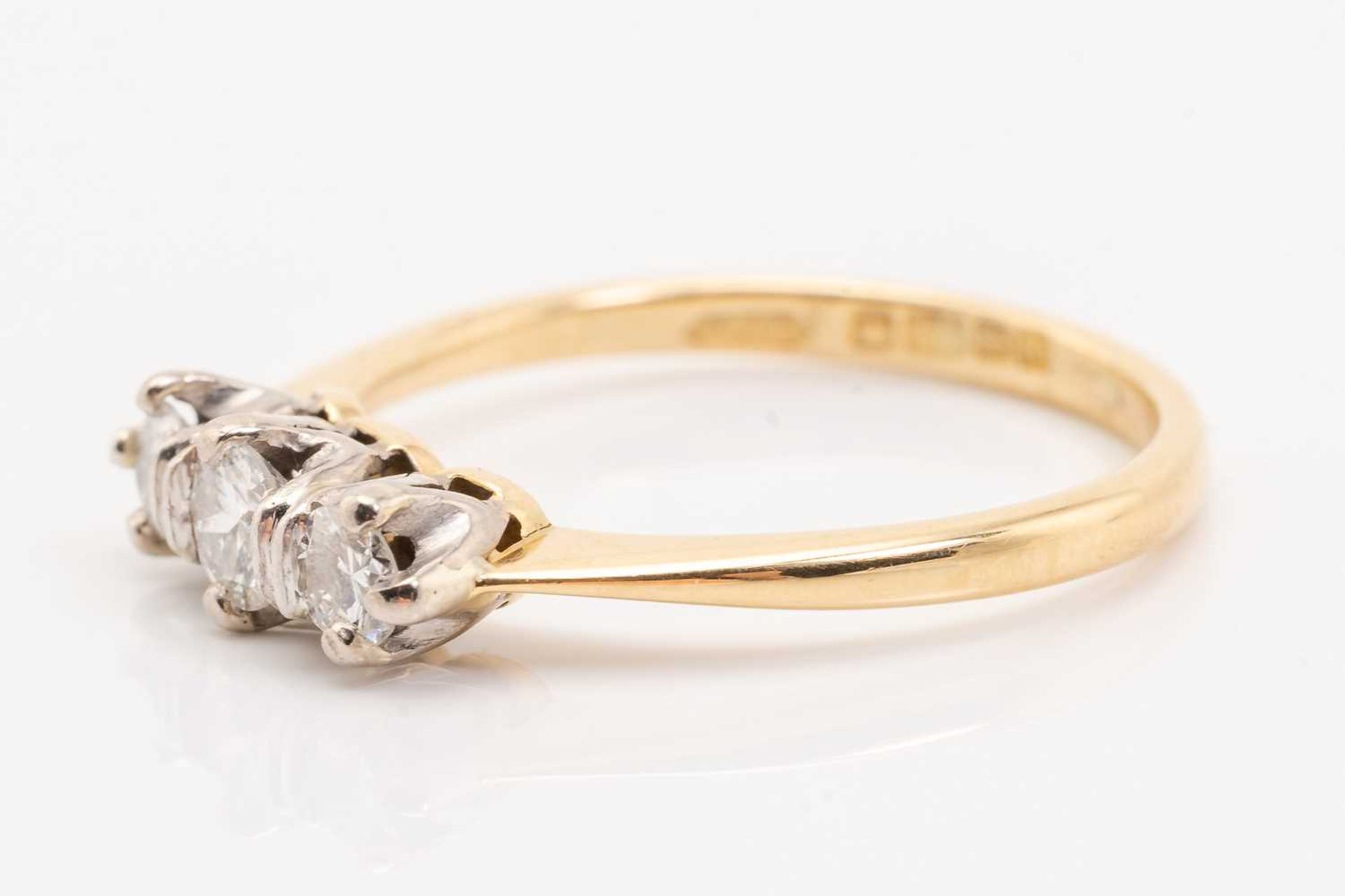 A yellow gold and diamond three stone half hoop diamond ring; the slightly graduated round brilliant - Image 3 of 5