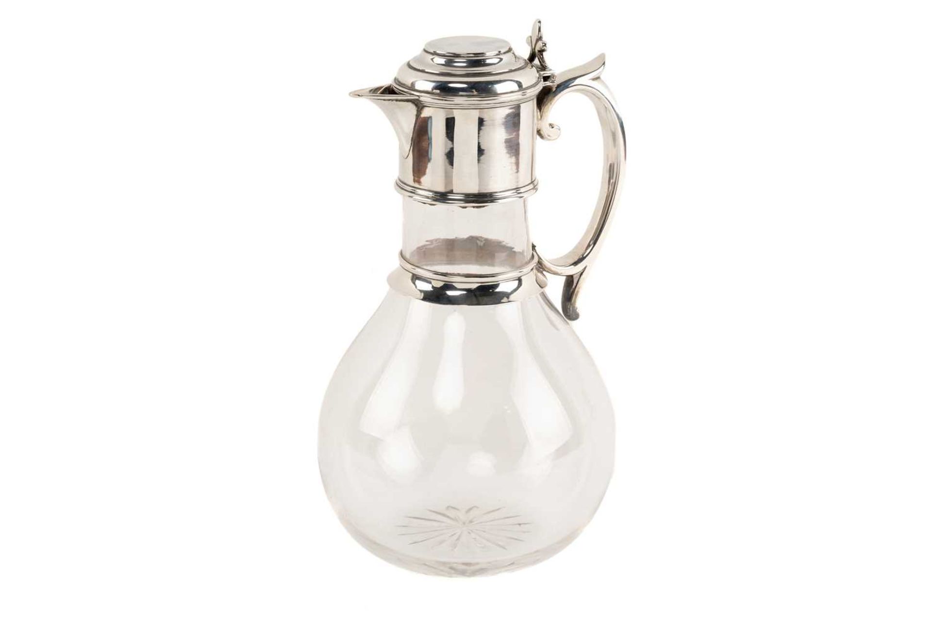 Victorian silver mounted clear glass claret ewer, London 1885 by Rupert Favell, with loop handle and