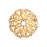 A continental scrollwork brooch embellished with white stones, the domed openwork mount has fitted