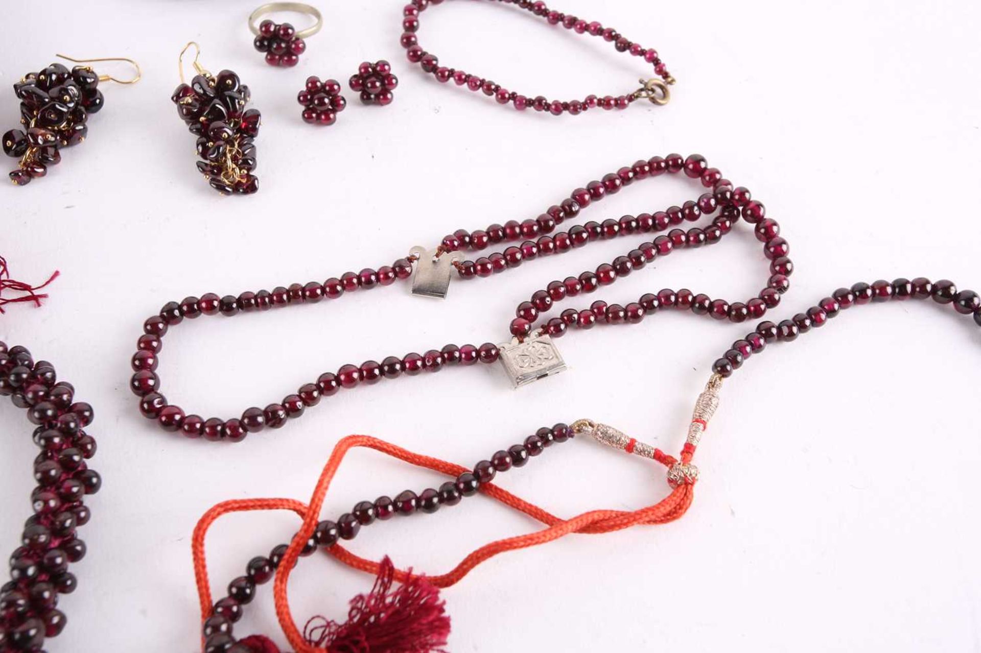 A large collection of garnet beaded jewellery; including four drawstring necklaces with adjustable - Image 5 of 8
