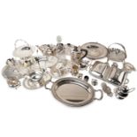 A large collection of silver plate including a three-piece tea set with pierced bands, various