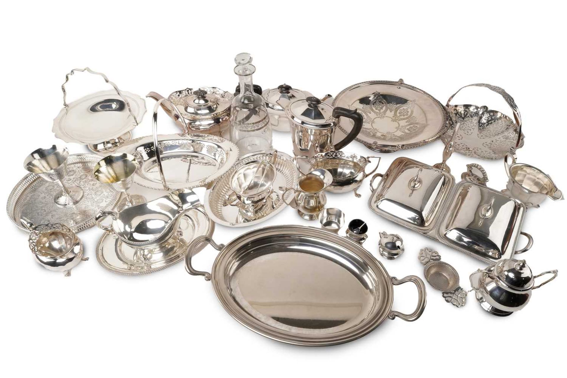 A large collection of silver plate including a three-piece tea set with pierced bands, various