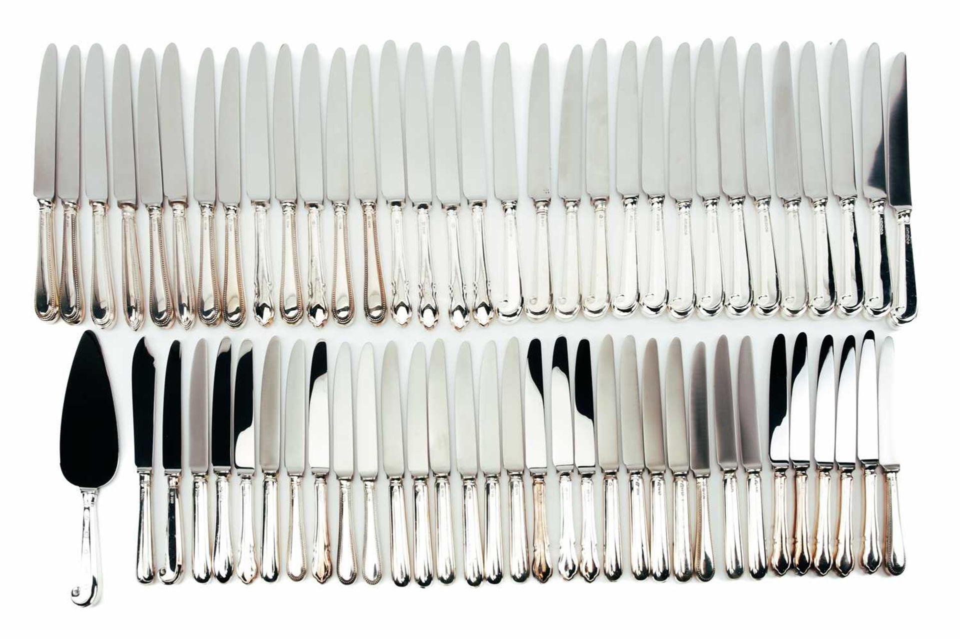 A mixed collection of various modern silver-handled cutlery, some with beaded borders, the others