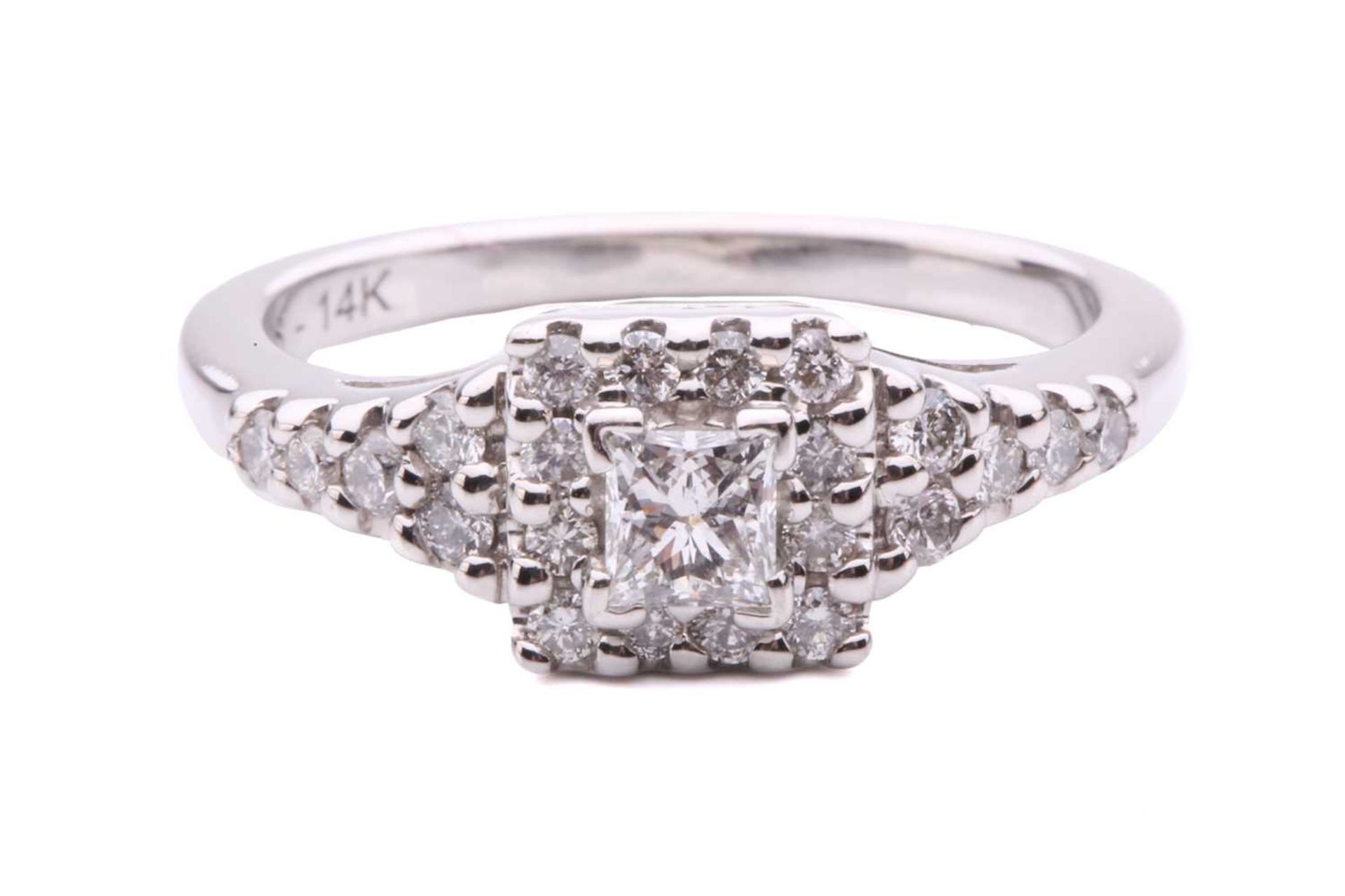 A princess-cut diamond cluster ring, with a central claw set princess-cut diamond measuring 3.5 x