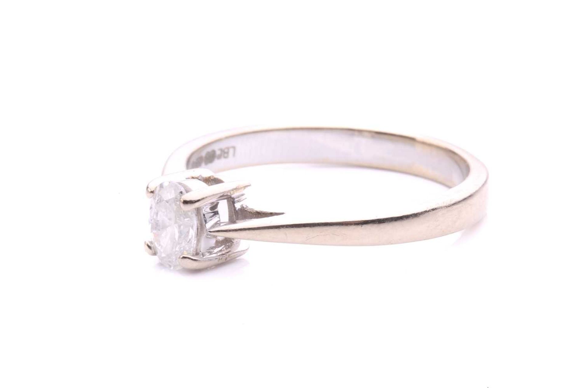 A diamond solitaire ring in 18ct white gold, consisting of an oval-cut diamond with an estimated - Image 2 of 4
