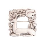 Georg Jensen - A square openwork brooch featuring a resting deer and squirrel in foliage, fitted