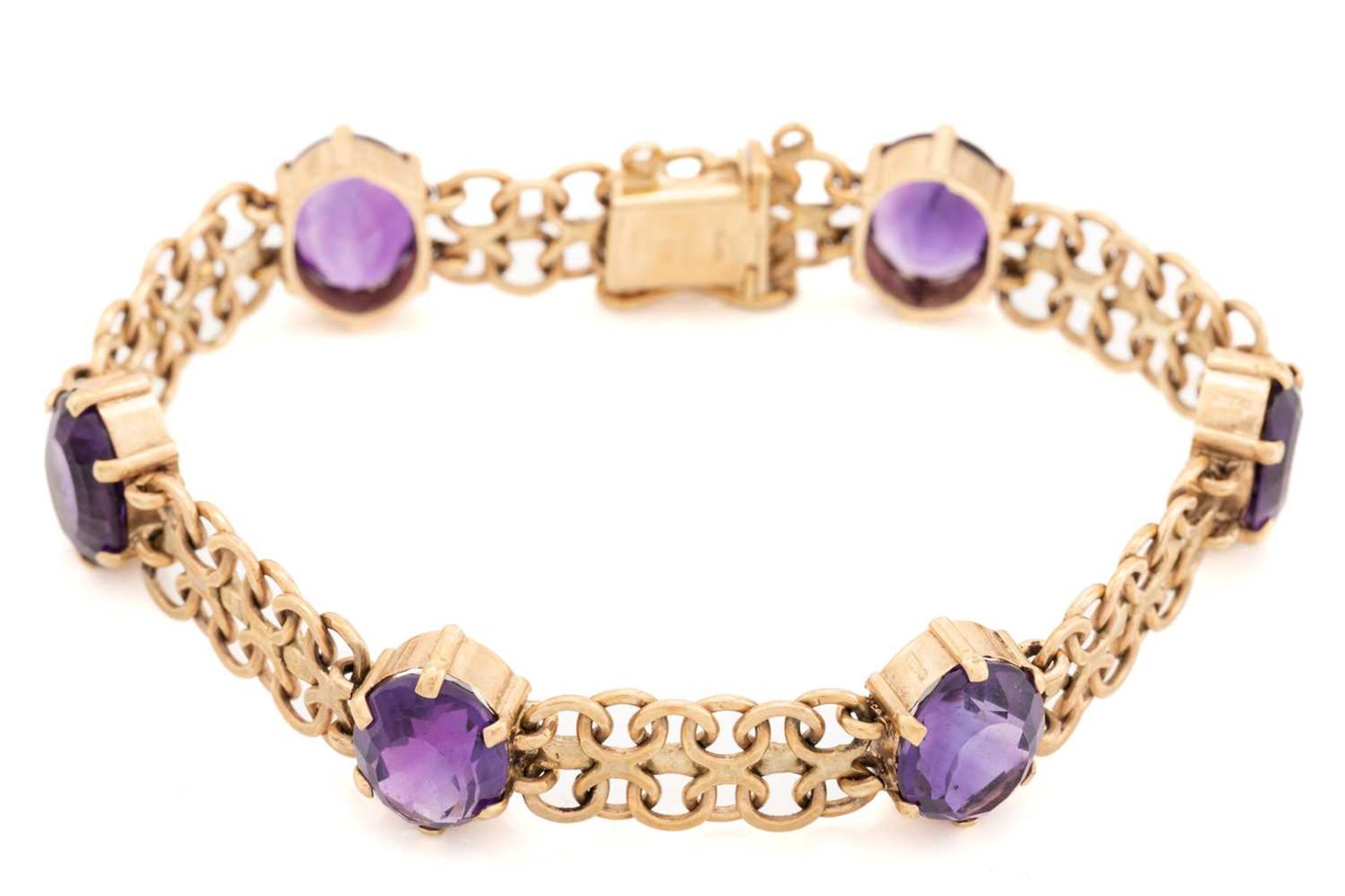 A bracelet set with amethysts in 9ct gold, comprising a wide bismarck link with six oval-cut - Image 5 of 5