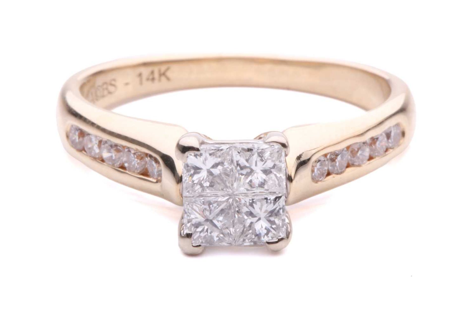 A princess-cut diamond ring with diamond set shoulders, with 4 illusion set princess-cut diamonds