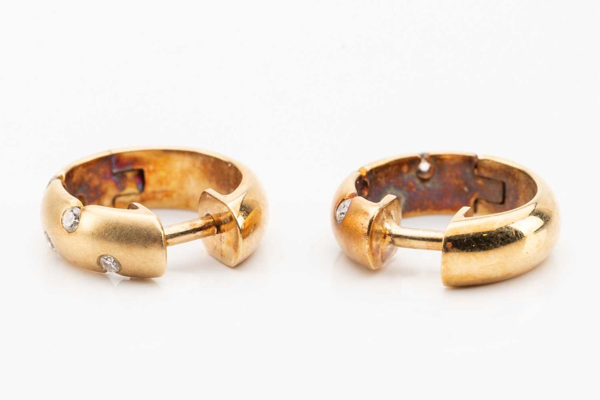 A pair of diamond set huggy hoop earrings, featuring sunk set round brilliant cut diamond in - Image 3 of 4